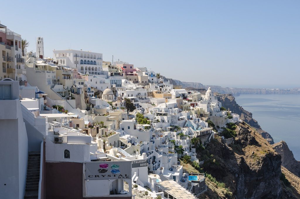 Whitewashed buildings and caldera-side steps in Fira, Santorini