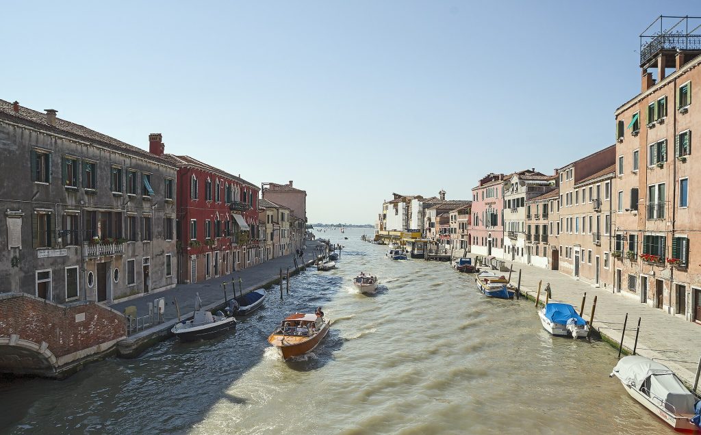 Cannaregio canal with boats and waterfront buildings in Venice